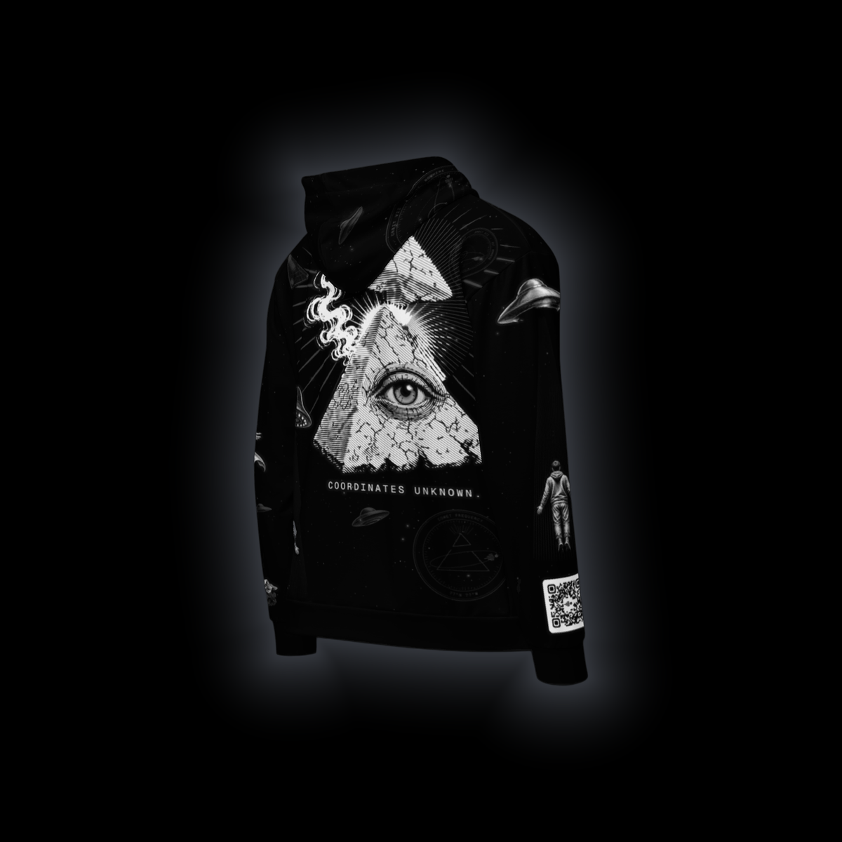 Coordinates Unknown zip hoodie, 3/4 right back view: eye-pyramid above COORDINATES UNKNOWN., saucers and seals, QR code on the sleeve, on black
