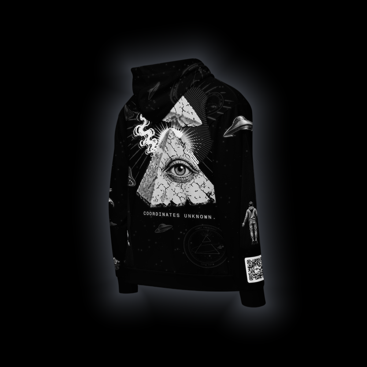 Coordinates Unknown zip hoodie, back view: eye-pyramid above COORDINATES UNKNOWN., a saucer lifting a figure in its beam, seals and stars on black, QR code on the right sleeve