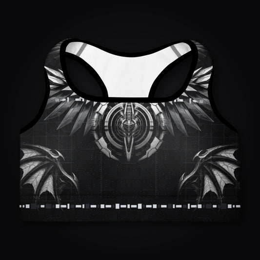 Deep Field Rite padded sports bra laid flat, front view, black with silver winged emblem artwork and white inner lining